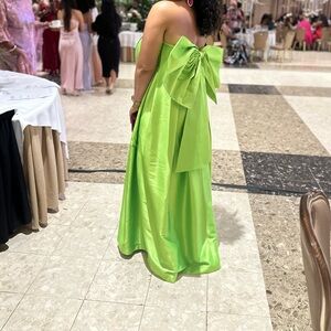 Long lime green dress with a big bow at the back. It's can be worn at weddings ,